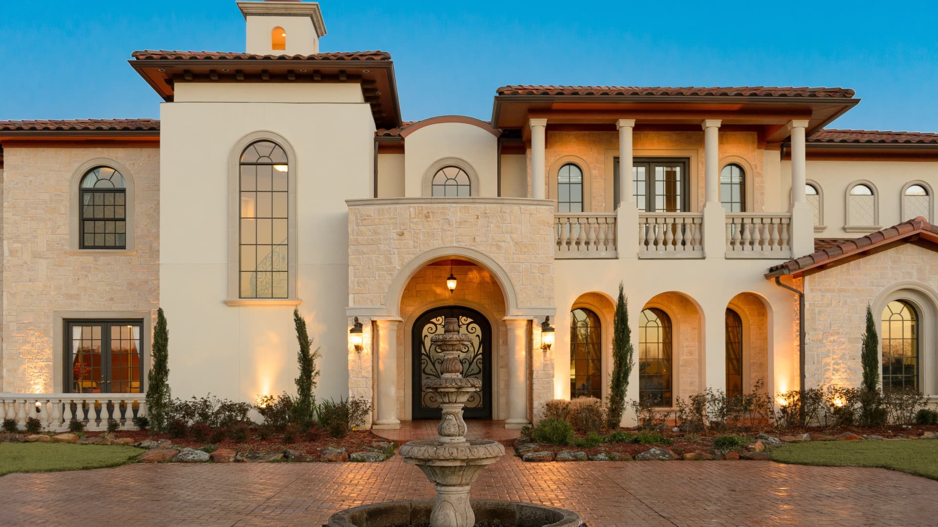 Estate architecture at dusk, evoking private wealth and stewardship